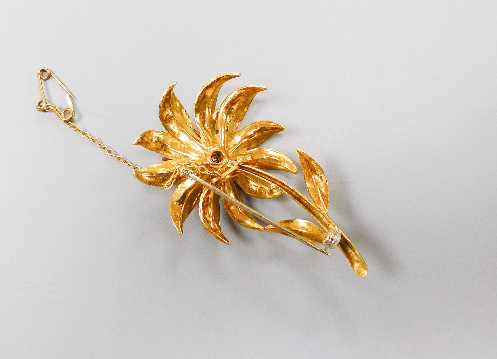 An early 1970's 18ct gold and seven stone diamond set flower brooch, by Cropp & Farr, London, 1972, 52mm.